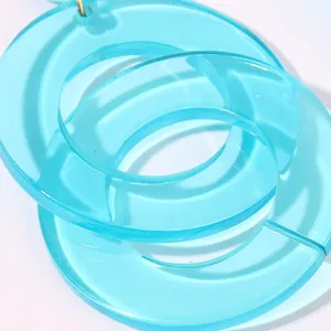 Blue transparent acrylic geometric round earrings, stylish interlocking design for summer wear.