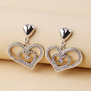 Stunning silver-toned rhinestone pavé double heart dangling earrings, exquisite detail shot.