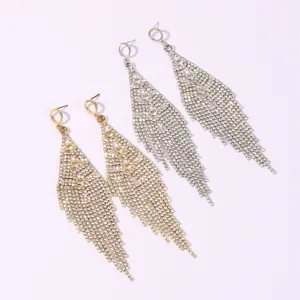 Detailed close-up of sparkling rhinestone fringe earrings, long crystal tassel design for night.