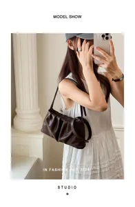 Stylish dark brown ruched shoulder bag for women, trendy underarm cloud bag with strap.