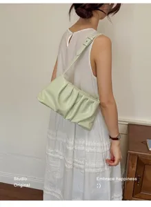 Light green ruched underarm bag for women, stylish summer shoulder cloud bag detail shot.