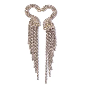 Stunning long rhinestone tassel earrings featuring elegant swan design for glamorous evening wear.
