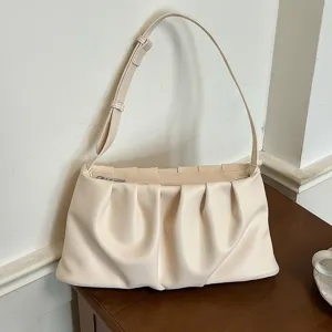 Chic beige ruched underarm bag for women, stylish summer shoulder and crossbody cloud handbag.