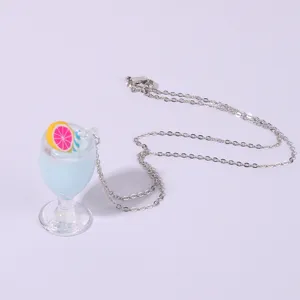 Close-up detail shot of summer lemon juice cup resin pendant necklace accessory.