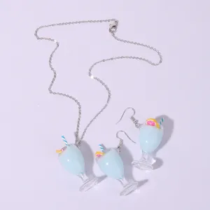 Summer lemon juice cup pendant necklace and earrings set, cute resin jewelry detail view.
