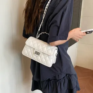 Chic white quilted chain shoulder bag for women, stylish crossbody handbag for summer fashion.