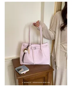 Woven leather tote bag detail, stylish pink shoulder bag for women daily commute use.