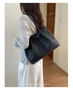 Black woven leather tote bag for women, large capacity shoulder bag for daily commuting style.