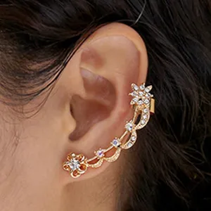 Gold rhinestone ear cuff wrap earrings with delicate hollow floral design for women fashion.