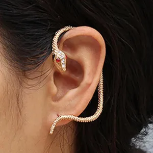 Gold snake ear cuff with sparkling rhinestones and red crystal eyes for women fashion jewelry.