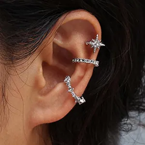 Stunning rhinestone ear cuffs detail close-up, sparkling crystal geometric ear bone clips.