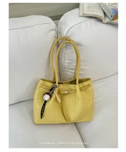 Yellow woven tote bag for women, PU leather casual shoulder handbag with top handles and belt.
