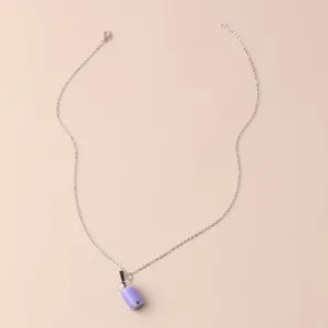 Close-up of the delicate boba tea cup pendant on a fine silver-tone chain necklace detail.