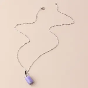 Silver chain necklace featuring a cute purple bubble tea cup pendant close-up detail.