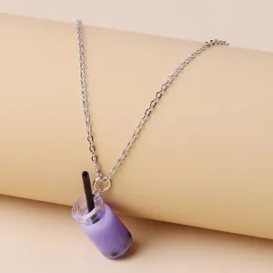 Close-up detailed view of the cute purple bubble tea cup pendant on a silver chain.