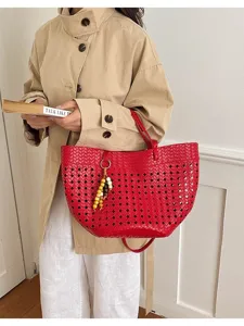 Red woven leather tote bag detail, hollow out design with charm, elegant casual commute style