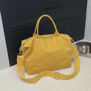 Gran bolsa de viaje para mujer, bolsa de lona impermeable, bolso cruzado informal para equipaje.