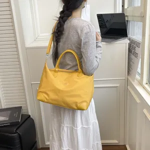 Bolso de viaje amarillo grande con bandolera, bolsa portátil para viajes cortos.