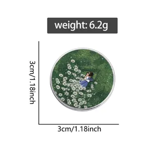 Broche ronde en métal avec illustration charmante de prairie verte et fille 3cm.
