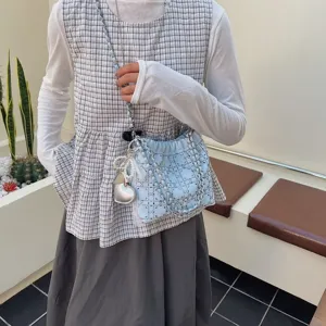Chic blue chain bucket bag for women, stylish quilted crossbody shoulder bag with pearl charm.