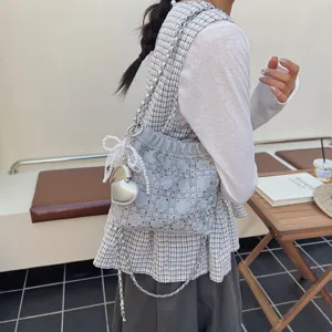 Summer fashion chain bucket bag with rhinestone grid, metal strap and pearl bow charm.