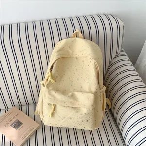 Joli sac à dos jaune imprimé d'étoiles pour l'école, sac de cours élégant et pratique.