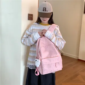 Sac à dos d'école en toile imprimé étoiles roses avec joli pendentif pour mode quotidienne.