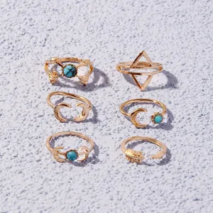 Gold metal ring set of 6 featuring turquoise stones, geometric triangles, and vintage moon designs.