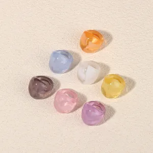 Colorful acrylic resin geometric rings set, minimalist fashion finger jewelry detail.