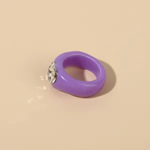 Purple acrylic resin ring with sparkling heart rhinestone, stylish detail view for women.