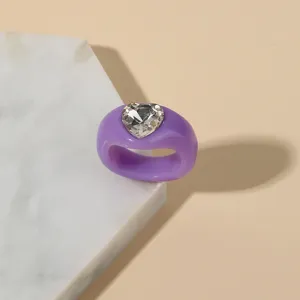 Stunning chunky purple acrylic ring with a sparkling crystal heart for modern women.