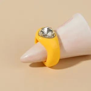 Yellow chunky acrylic ring with a large faceted heart crystal for stylish women fashion jewelry