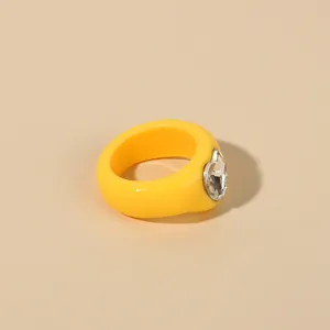 Chunky yellow acrylic ring with rhinestone heart design, trendy fashion statement jewelry for women
