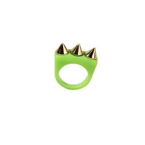 Chic neon green acrylic ring featuring three gold-tone metallic cone spike studs for a bold punk statement.