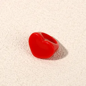Red acrylic heart ring detail shot, minimalist resin jewelry for women fashion style.