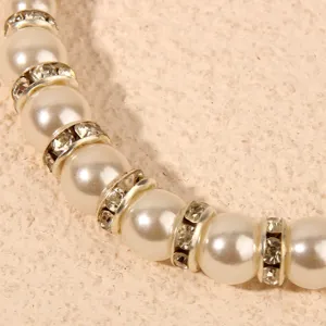 Pearl and rhinestone bracelet detail view, elegant shiny crystal metal spacer beads.