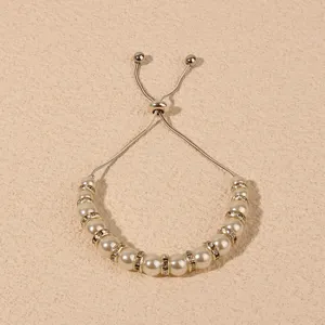 Elegant pearl rhinestone adjustable bracelet with sliding metal clasp for women fashion.