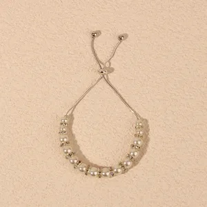 Adjustable pearl rhinestone bracelet detail showing sparkling crystals and shiny beads.