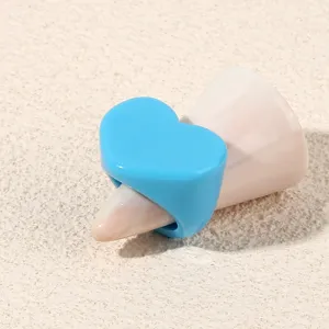 Blue acrylic heart ring detail shot, minimalist geometric style fashion jewelry for women daily wear.