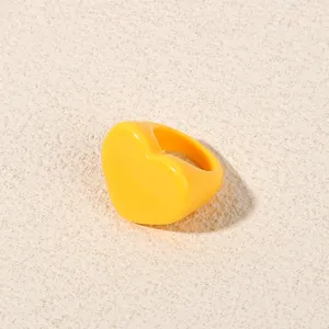 Bright yellow heart-shaped acrylic ring detail. Stylish chunky resin ring for daily wear.