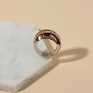 Close-up of a trendy chunky transparent brown resin ring showcasing its smooth polished surface.
