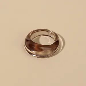 Detailed close-up view of the chunky brown resin acrylic ring showcasing translucent texture.