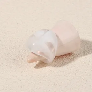 Minimalist translucent white acrylic ring detail view, elegant geometric fashion jewelry style.