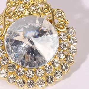 Gold crystal stud earrings featuring large clear rhinestones for women fashion jewelry.