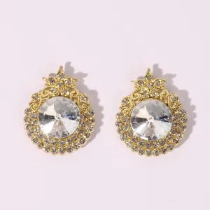 Detailed view of elegant gold crystal stud earrings with sparkling rhinestones for women.