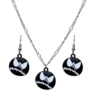 Detail of Halloween skull pendant necklace and matching earrings set with black white design.