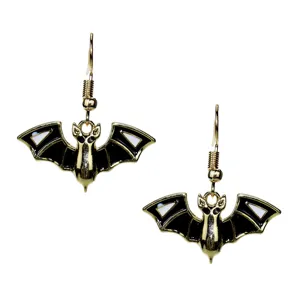Close-up detail shot of gothic punk style gold and black enamel bat earrings for halloween.