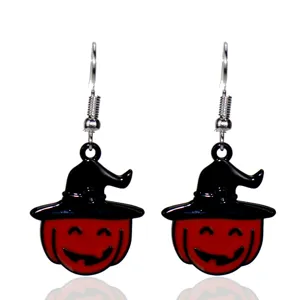 Detailed close-up of Halloween witch hat pumpkin earrings, creative festival drop jewelry.