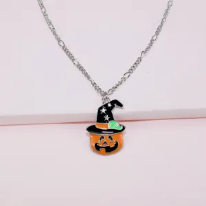 Close-up detail of Halloween pumpkin pendant necklace with cute star witch hat design.