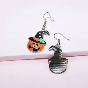 Detailed view of Halloween pumpkin witch hat earrings featuring alloy enamel festival jewelry style.